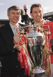 Wenger and his captain celebrate